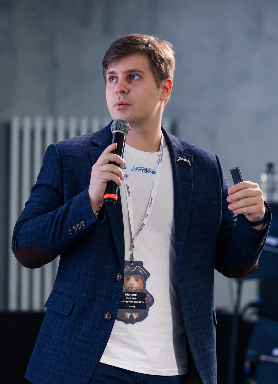 Max Knyazev speaking at a cybersecurity conference
